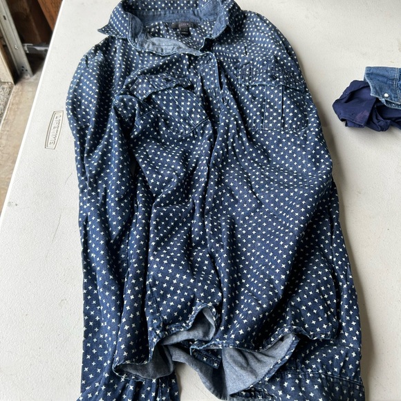 Denim shirt worn over a white tank - Picture 2 of 2